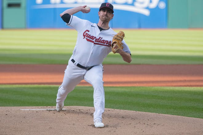 Cleveland Guardians starting pitcher Shane Bieber delivers against the New York Yankees during the first inning of a baseball game in Cleveland, Monday April 10, 2023. (AP Photo/Phil Long)