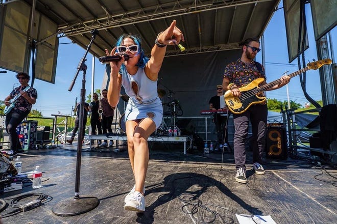Jackie Popovec and The Vindys are shown performing at the WonderBus Music & Arts Festival in Columbus in August. The popular Northeast Ohio-based alt rock band will play a concert with the Canton Symphony Orchestra on Saturday.